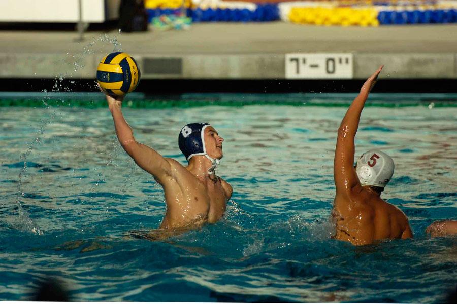 Varsity waterpolo player Andrew Lindsay(8) goes for a point against Laguna Hills opponent. 