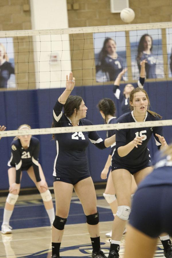 Mikena Werner and Samantha Dayton prepare as the ball is served.