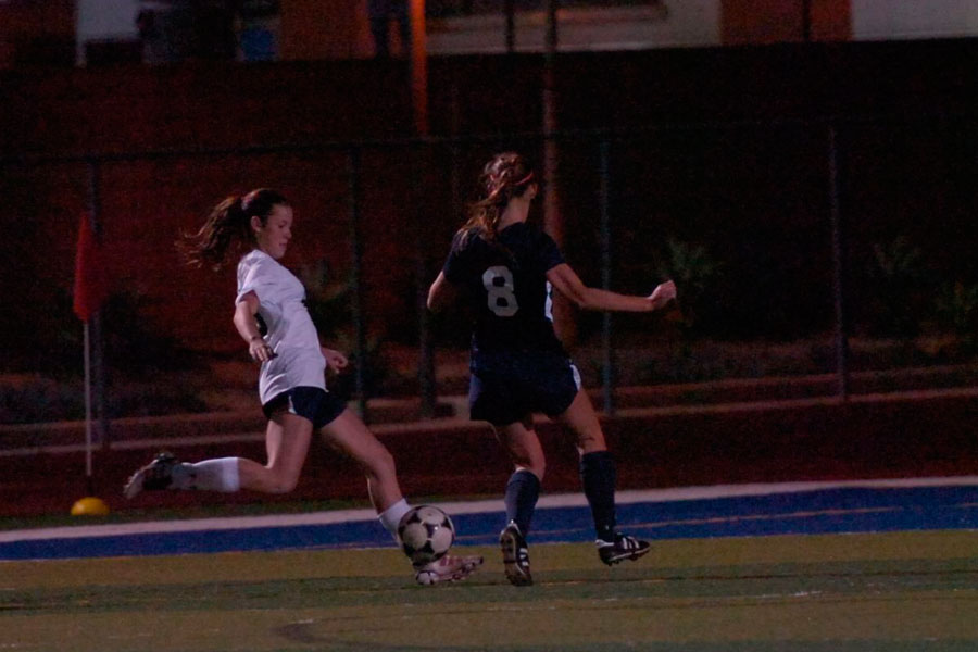 Shayna Larson strikes the ball towards the opponent goal. 