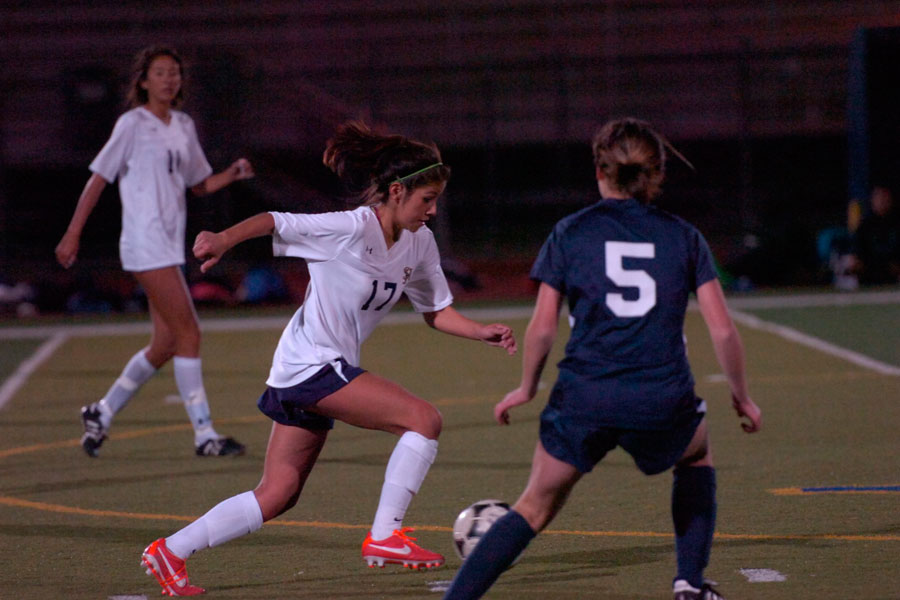 Alison Martinez uses her skills to dribble the ball away from her opponent.