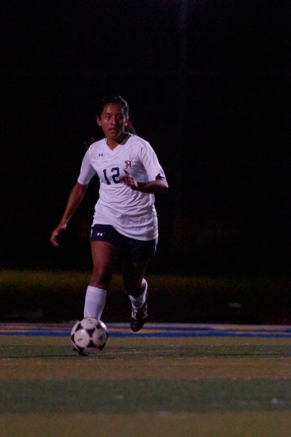 Vanessa Gonzales defends the goal and dribbles the ball to the opponent side. 
