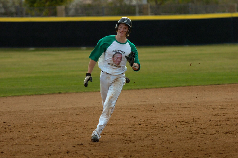 Josh Robinson(12) runs from second base to home.