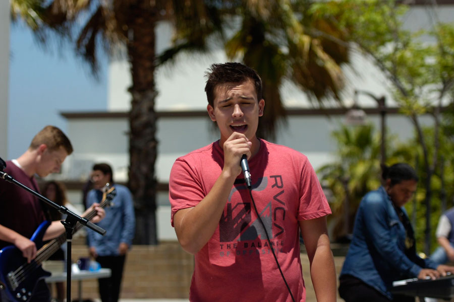 SINGING YOUR HEART OUR: Luke Holland shows off his vocals and leads the band in a song. 
