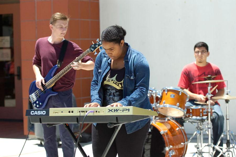 ROCKING NROLLING: Dazmin Arnaud, Grant Dossey , and Andres Hernandez perform together to showcase the Commercial Music Show in the theater. 