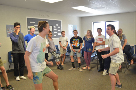 Cole Henriksen (12) and James Garwood (12) are in a heated competition for a spot on the comedy sports team.