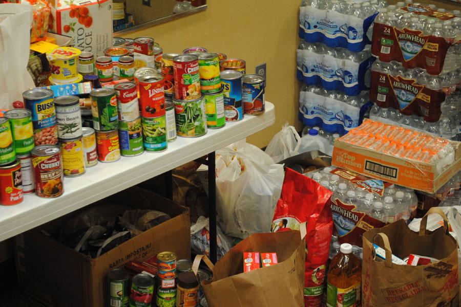 A variety of donated foods lie in wait to be gifted to those in need of their use. The Thespian Society has organized volunteers to distribute this culinary goodness as needed. 