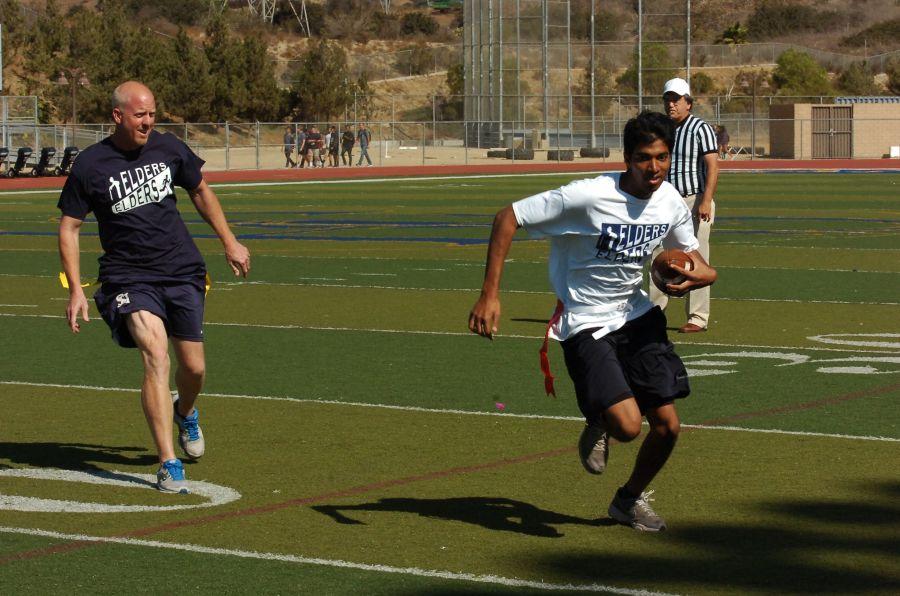 Sanjan Kumar (12) escapes from Mr. Summers pulling his flag and makes a long run for the touchdown. Mr. Ressler observes the play and is stunned by Sanjans speed.