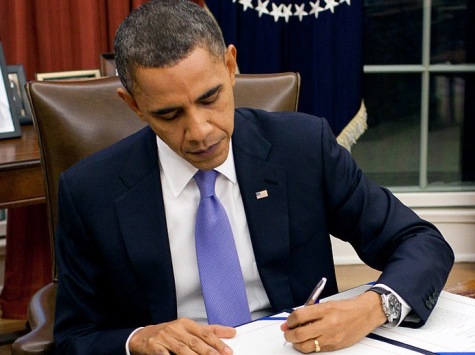President Obama takes action at the Resolute desk. Many times, he has claimed he can and will utilize his pen to exercise unconstitutional authority via the Executive Order.