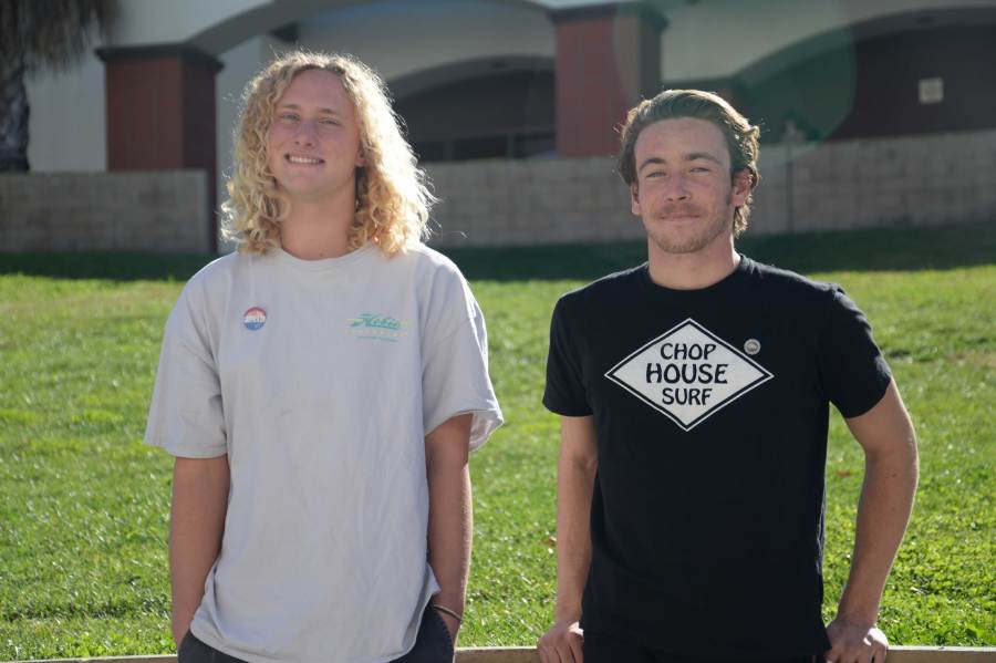 STOP, CHOP, AND SURF: Michael Iacometti (12) (left) and Alex Pagan (12) (right) smile proudly after being interviewed regarding their surf company Chop House Surfboard Repair Shop. Chop House works to get surfers back in the water within the same day their board is damaged at about half the price of their competitors. They also sell surf products such as fins and hand planes to enhance your surf experience. Photo by Andrew Fehlman