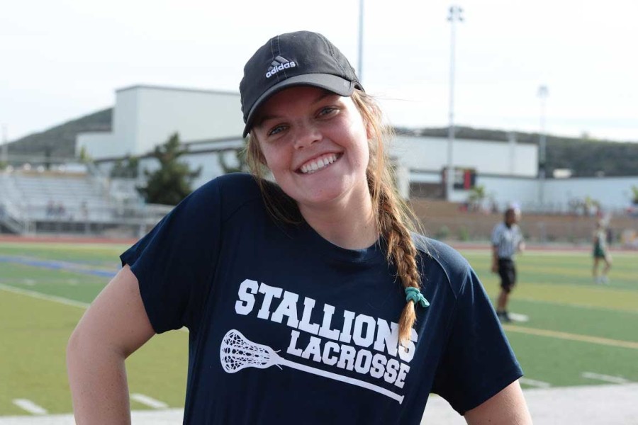 FISHING FOR INSPIRATION:  Journey Fischbeck (11) was unable to play for 30 days due to CIF transfer rules, and became a temporary coach to the girls varsity lacrosse team. She prepares to help lead the team to victory on the sidelines until she can get back on the field. Photo by Kaela Lawson.
