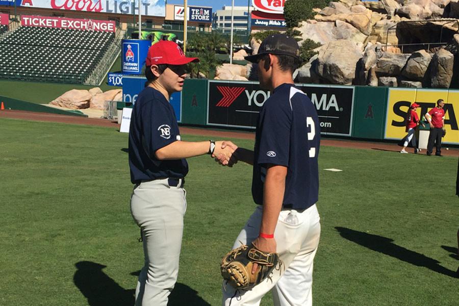 Jack Dryer (11) introduces himself to a young athlete participating in the Challenger Game at Angel Stadium. The Stallions had a long afternoon making sure the players had a great experience. 
