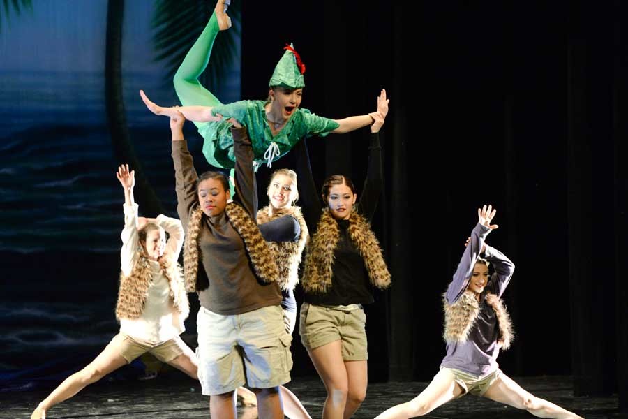 Peter Pan, played by Maddie Butler (10), soars into the air with the assistance of his lost boy dancers, who performed a dance based on the Return to Neverland theme for Homecoming 2015.  This dance was performed not only at fusion, but at both pep rallies and the Homecoming football game too.
