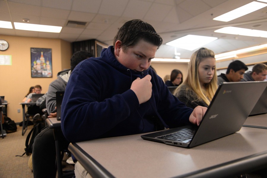 John McShane (10) works on his hipster grant project, where students have to create their own web page. Mr. Kaisers class won the contest to win a fund to pay for the National History Day competition.
