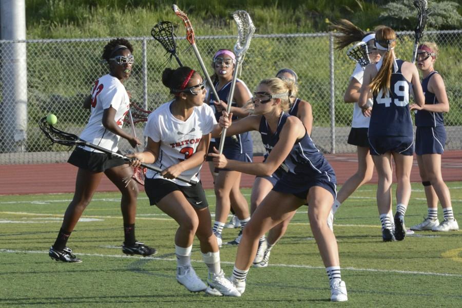 Midfielder Taylor Austin (10) firmly stands her ground against San Clementes Shay Heft (10) as she drives to goal, contributing towards the 12-10 win.  The Stallions are headed into a great season, with a 9-1 overall record. 