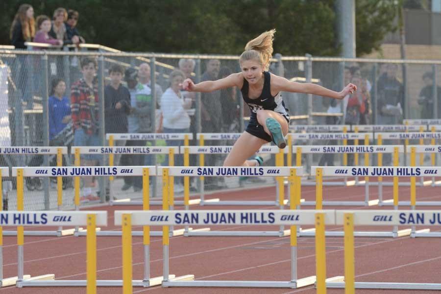 Elexa Happy (10) leaps over hurdles in the 100 meter.  This year’s track & field program consists of many quick and athletic students.  Jose Soler-Crespo (12) came in 7th overall in the March 10 meet for the 800 meter run and Katie Camarena (12) won the women’s 1600 meter run.
