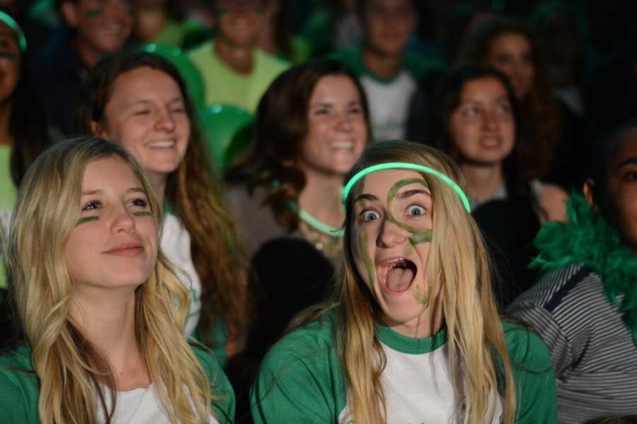 Kasey Lewis (10) and Macey Skousen (10) show their enthusiasm and sophomore spirit during the Mar. 25 pep rally, decked in all green (the sophomore class color).