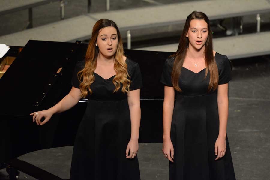 Kylie Lugo (12) and Kelsey Hampson (12) perform a duet together at the Spring Choir Concert.  While most songs were sung in English, some were in languages such as Italian and German, which require weeks of practicing pronunciations of words along with learning the melodies and harmonies.