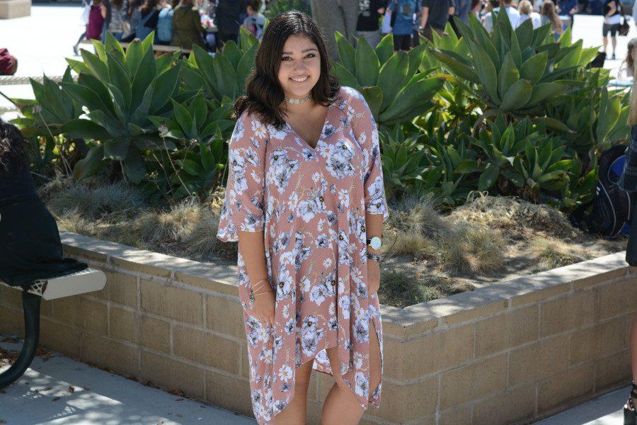 Victoria Barcelo (11) sports a floral dress similar to attire seen on the runway during Fashion Week. Barcelo is one of the many SJHHS students who  have been spotted following Fashion Week trends.