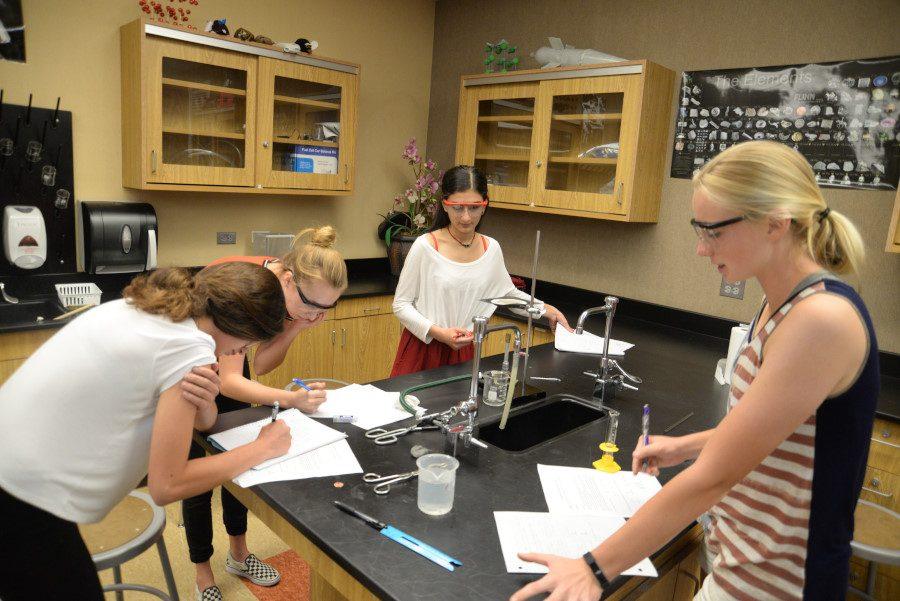 Students work on a chemistry lab to enhance their knowlege about various chemicals and their effects. Instruction and curriculum are two of many aspects under evaluation by the WASC committee. 