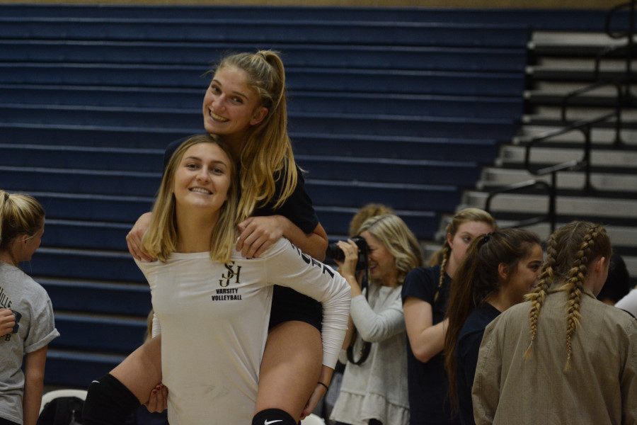 Madi Mercer (12) gives  Katie Lukes (11) a piggy-back ride at one of the games, fully displaying how their silly and sweet dispositions form such a great friendship.