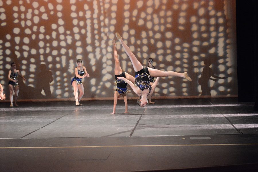 Sloan Goldfader (10) of Advanced Dance Production does an aerial during the opening piece of the second act.
