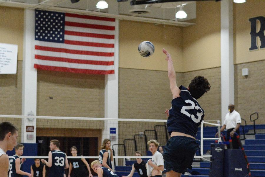 Varsity captain Jared Tretter serves one of the many service aces the team gained against Villa Park High School. The varsity team won 3-1 at their first home game of the season.