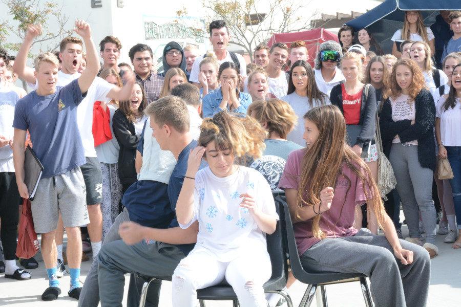 Danielle Satterwhite, Roxanna Amirazizi, Teddy Conover score a seat in musical chairs as Brigham Hill sits on Cayden McCluskey’s lap in hopes of not being eliminated.
