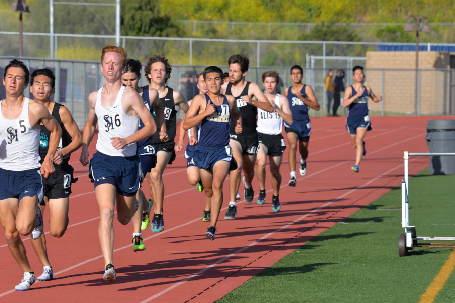 Connor Yartz (12) and Brody Ray (12) run alongside each other in the 800m men’s race. SJHHS finished with three runners in the top six.