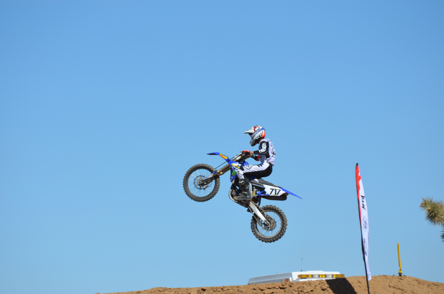 Kyle Bengelsdorf hitting a huge jump during one of his motocross races. He races a 250cc dirt bike which has plenty of power to send him soaring through the air. Photo by Dalton Flores
