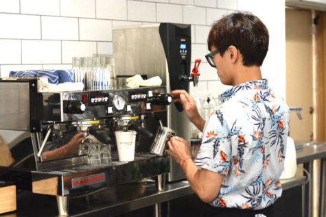 Gary, one of the four managers currently working at Rapport Coffee in San Clemente, demonstrates how they make a cafe latte. All of Rapports beans used in their coffee drinks are roasted in Los Angeles by the managers for the highest quality flavor.