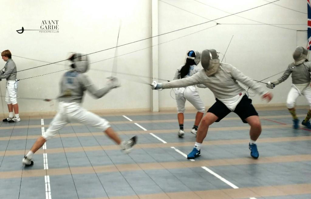 Lucas Winkler (right) is competing in a practice sabre fencing match against another member of his fencing club, Avant Garde Fencing. He travels to LA to practice 3-4 times a week.