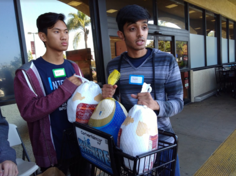 Juniors Jaylan Patel and Matt Fong hold three frozen turkeys outside a local grocery store. The boys, along with junior Brandon Tong, were invited to go in the store and fill two carts with donations, after a stranger offered to pay for everything. The club ended up collecting enough food to feed 100 families. It donated to underprivileged families in San Juan Capistrano and to the families of deployed Marines who live on the Camp Pendleton base. 
