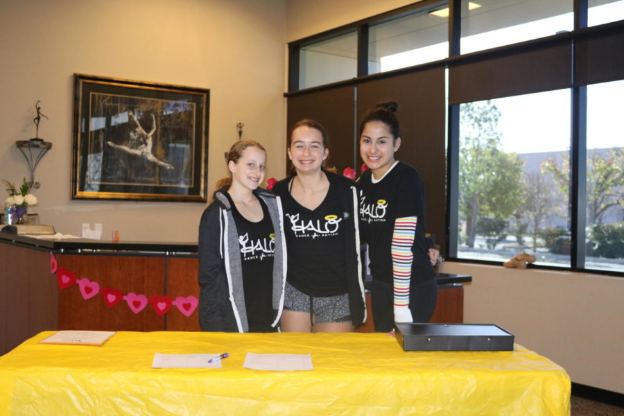 Club leaders, Lindsay Backer, Megan Brooks, and Jordyn Apostalache (order left-right) await dancers to sign up to take master classes. All of the funds raised went to the HALO Dance 4 Autism Foundation. 