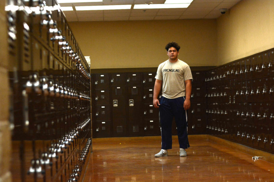 Sean Rhyan stands among the D building lockers at SJHHS.
