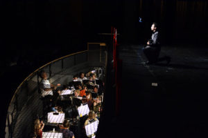 Javert, the antagonist,  played by Zain Farqui (11), displays his trouble over protagonist Jean Valjeans, played by Jaymes Macabale (12), evasion of the law. His performance is brought to life by the pit orchestra. 