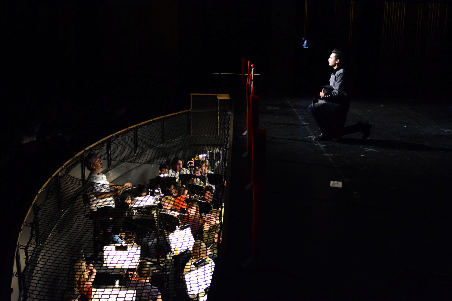 Javert, the antagonist, played by Zain Farqui (11), displays his trouble over protagonist Jean Valjean's, played by Jaymes Macabale (12), evasion of the law. His performance is brought to life by the pit orchestra.