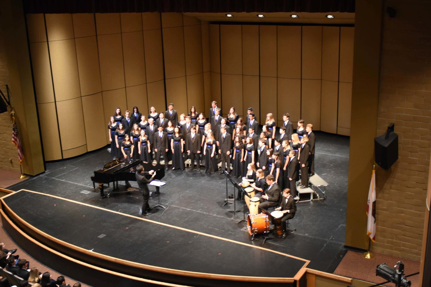 SJHHS Chamber choir performing their fall repertoire. Accompanying them are percussionists from the SJHHS band.
