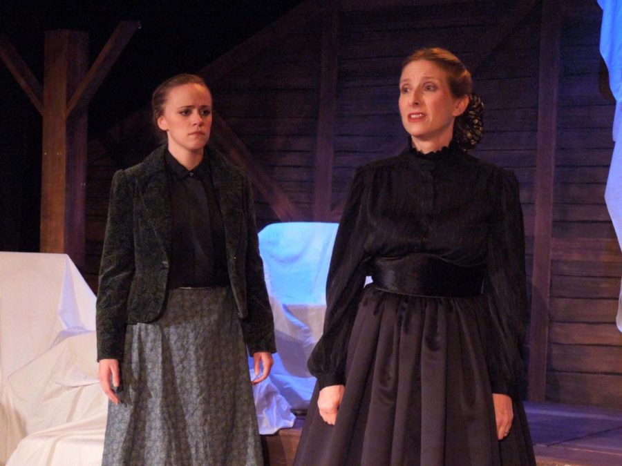 Emily Price acts as Marmee in the play, Little Women, accompanied by her colleague, Jo, at the Costa Mesa Playhouse.