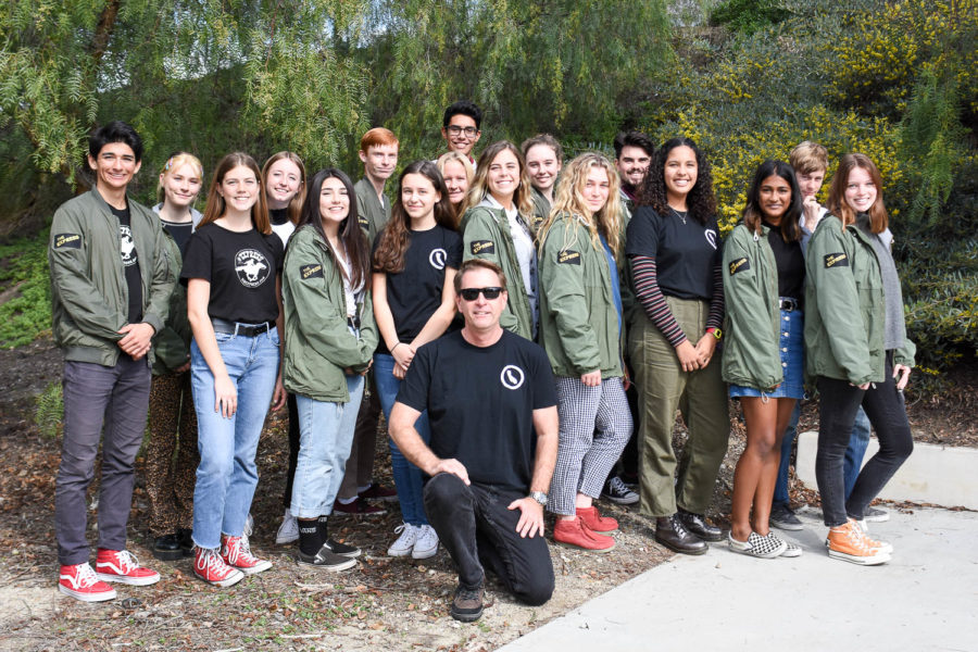 The 2018-2019 Express staff wearing shirts that quote California Education Code 48907. 