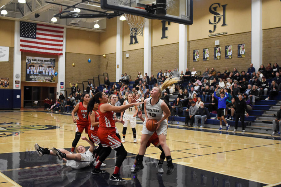 Jordan Pankhurst (12) getting ready to make a basket at their CIF game against Pioneer High School. Parkhurst makes an average of 10.4 points per game.