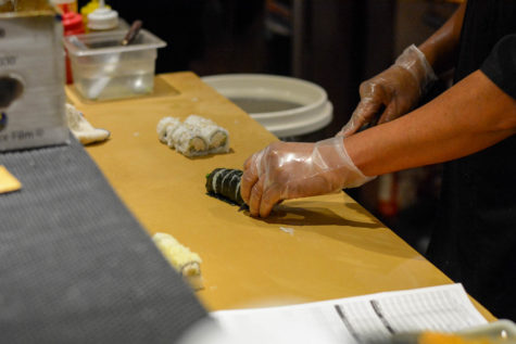 A chef at Zenko Sushi makes a California Roll and Crunch roll for a couple that came in as soon as they opened on Monday at 5:00 PM. They are typically open at 10:30-2:30 PM, and then reopen 5:00- 9:30 or 10 PM depending on the day of the week.