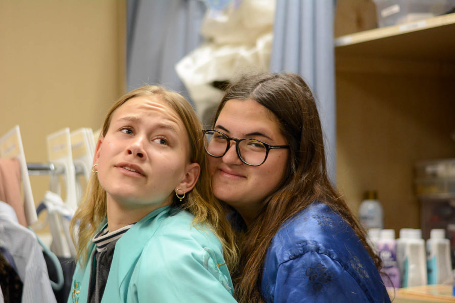 Orange County Varsity Artist Finalists, Lila Holley (left) and Sierra Young (right) pose among the many costumes in the Stallion Theatre Companys wardrobe and prop room.