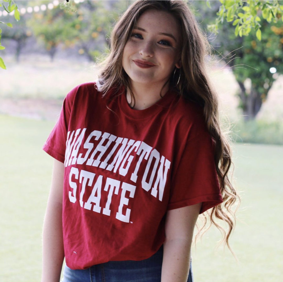 Upcoming freshman college student, Isabella Smedeby, poses for the camera clad in red to represent her committment to Washington State University.