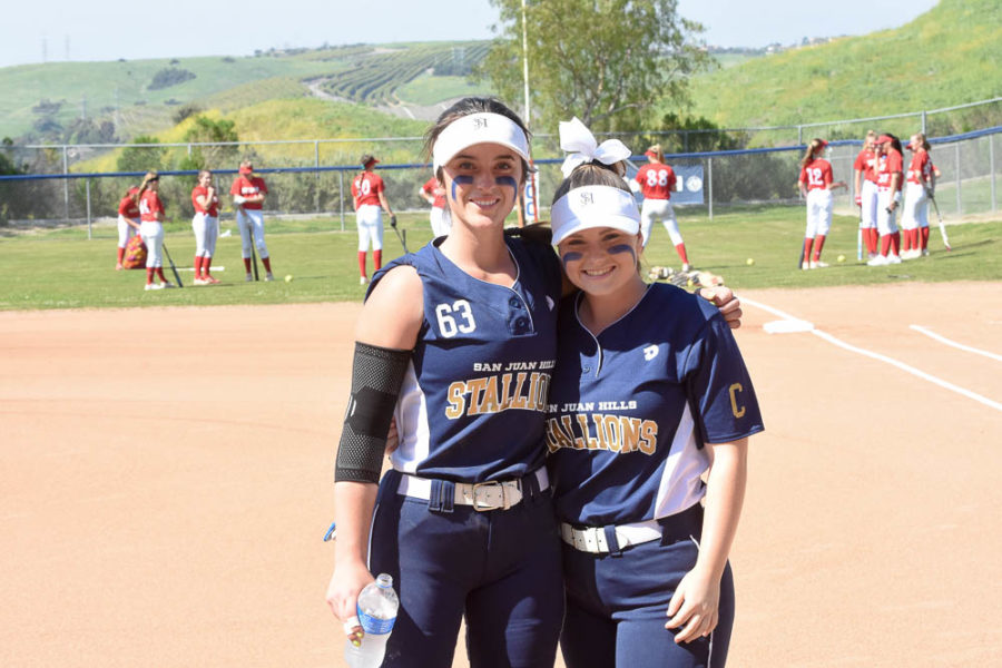 Catcher, Sabrina Javorsky and pitcher, Phoebe Popplewell smile together before a game together against Mission Viejo. 