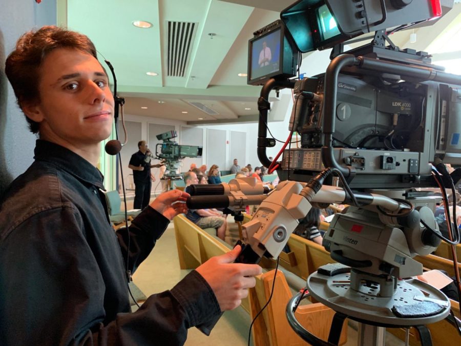 Oliver Rudolph (12) works the camera filming his church service. In addition to recording films for his church, Rudolph works on music videos, that can be found on various social media platforms.  Currently, he is pursuing a career in the film industry.