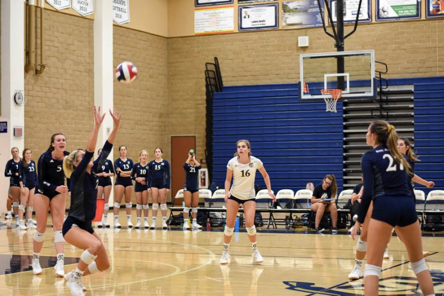 KILL, RELOAD: Andie Stone (12) sets up another player to spike the ball against Trabuco Hills High School in a league game on September 17. San Juan Hills High School took the second and third set, but ended up losing the match 3-2.