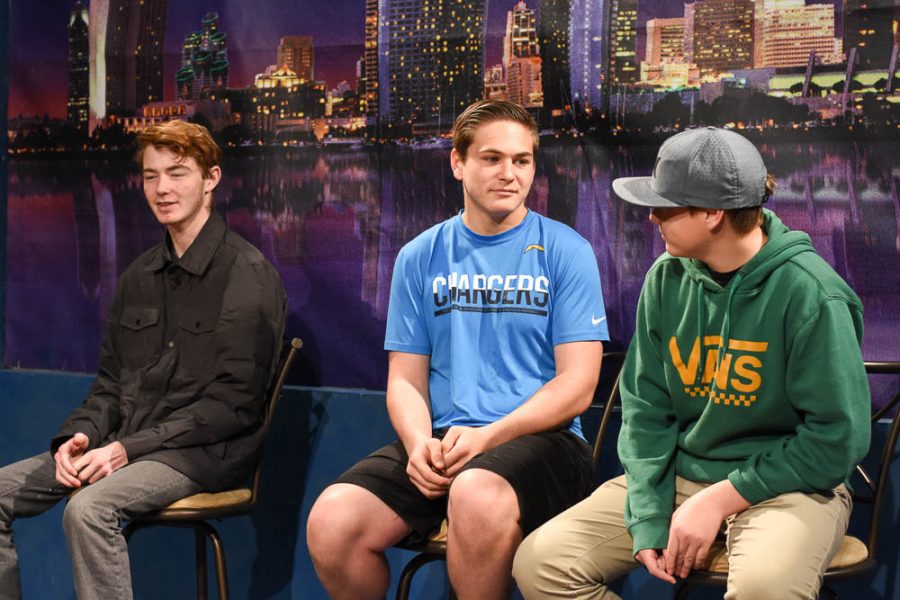 From the left, Schafer Welsch (12), Ryan Sisson-Burack (10), and Parker Gorton (10) are filmed for an episode of The Mane Event. Behind the scenes, the students work together to adjust the sound, lighting, and camera for the edition.