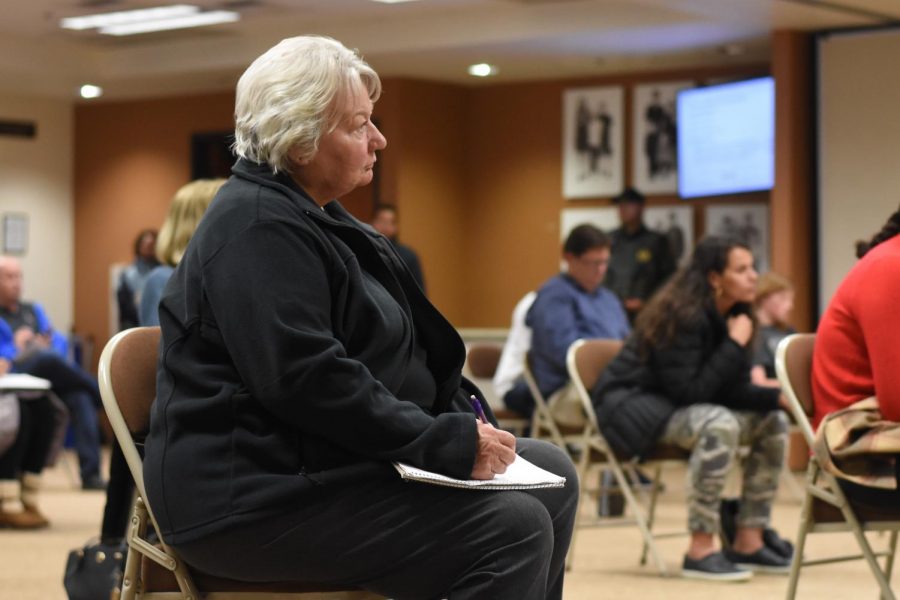 A woman listens to a parent discuss his concerns about how the school closure will impact his four children. During the meeting on March 13, four different speakers went up to the board to ask the board questions about what CUSD will be doing moving forward.