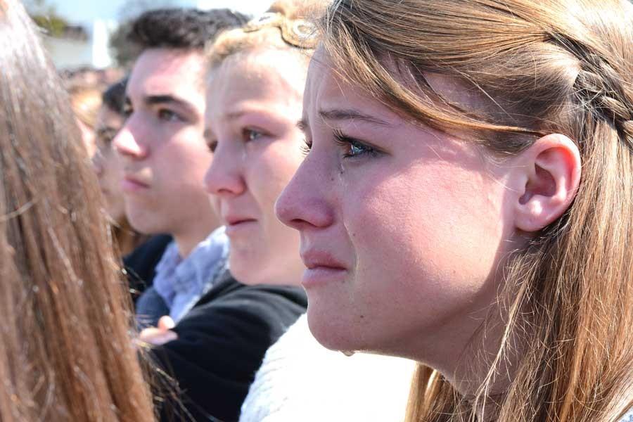 In 2016, seniors Tess Smolders, Claire Taylor, and Damian Ballard react to the mock crash scene depicted in the Every 15 Minutes program.
