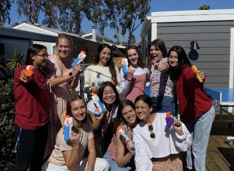 A group of seniors pose with their guns on the first day of Senior Assassins. The game was cut short last week due to COVID-19 concerns, the first year without a winner.